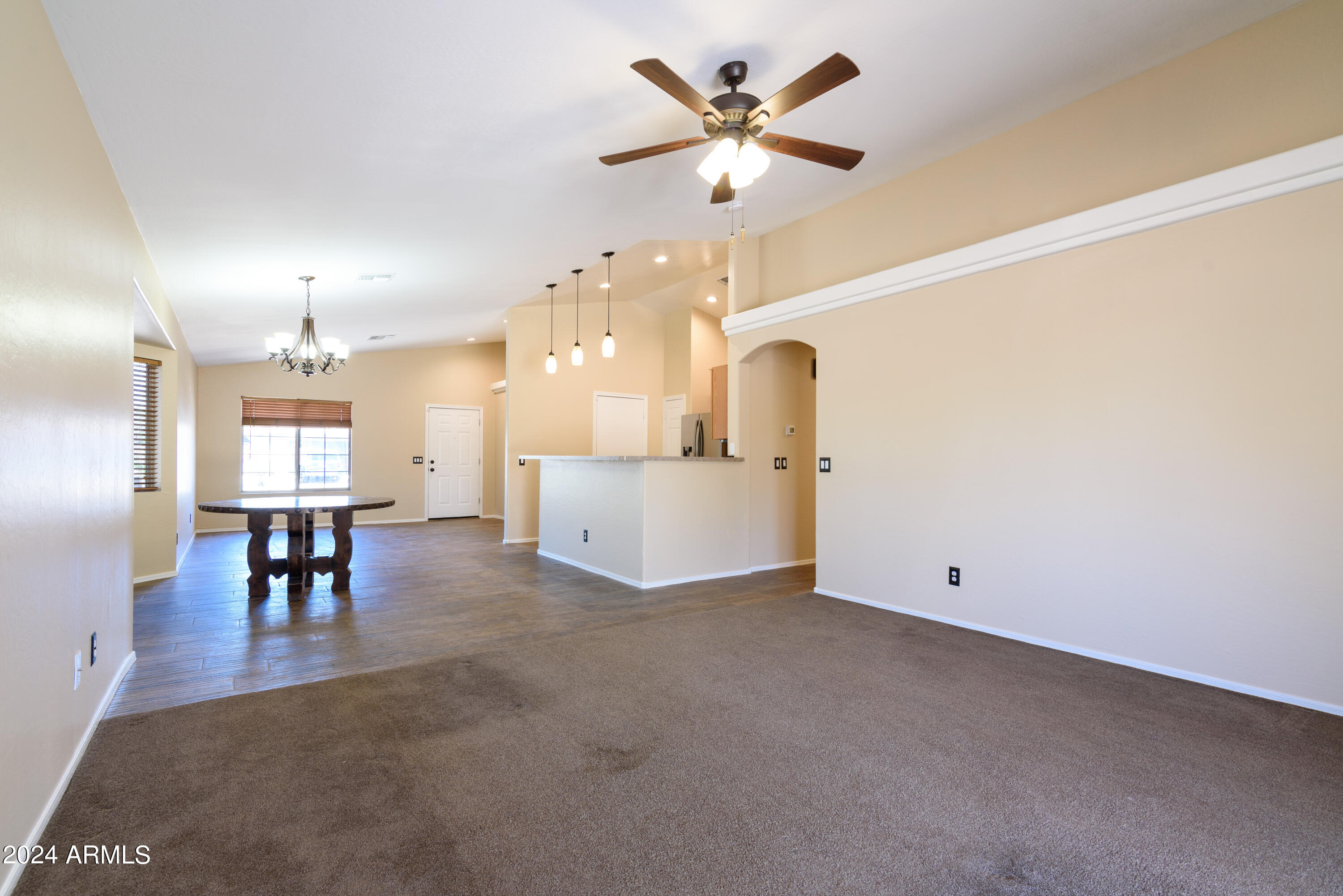 10649 West Monte Vista Road Avondale, AZ 85392 - Photo 12 of 28 a view of a livingroom with furniture and a chandelier
