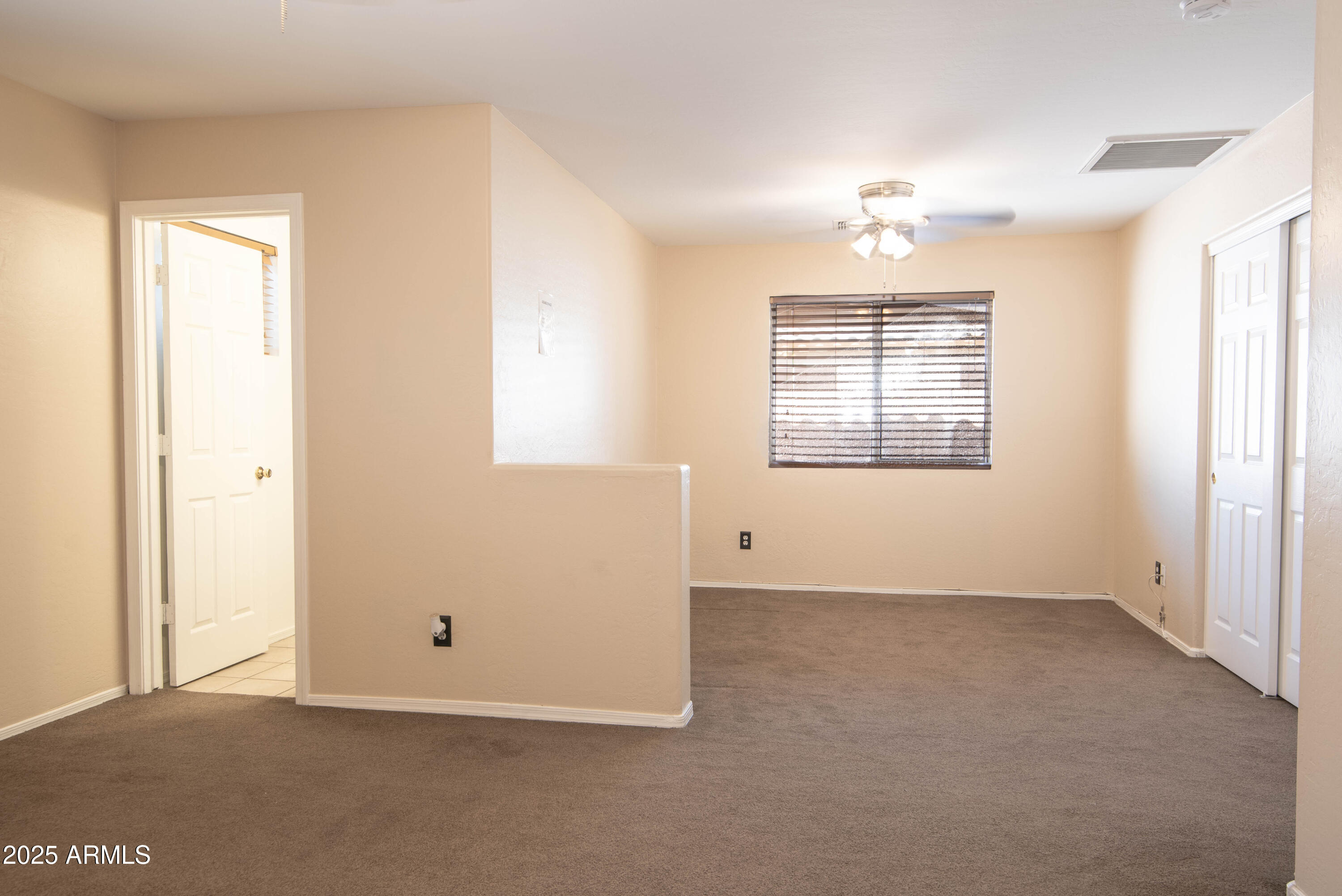 10649 West Monte Vista Road Avondale, AZ 85392 - Photo 16 of 28 an empty room with windows