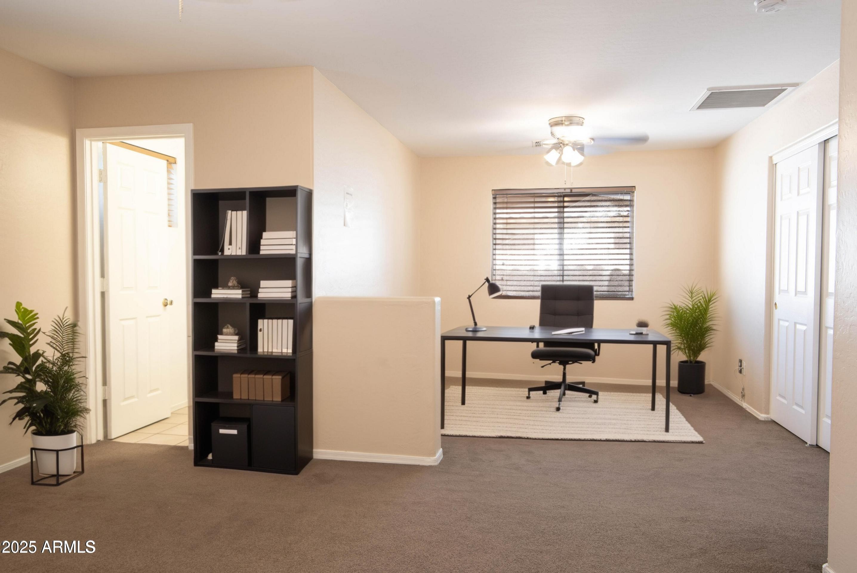 10649 West Monte Vista Road Avondale, AZ 85392 - Photo 17 of 28 a view of a livingroom with furniture and window