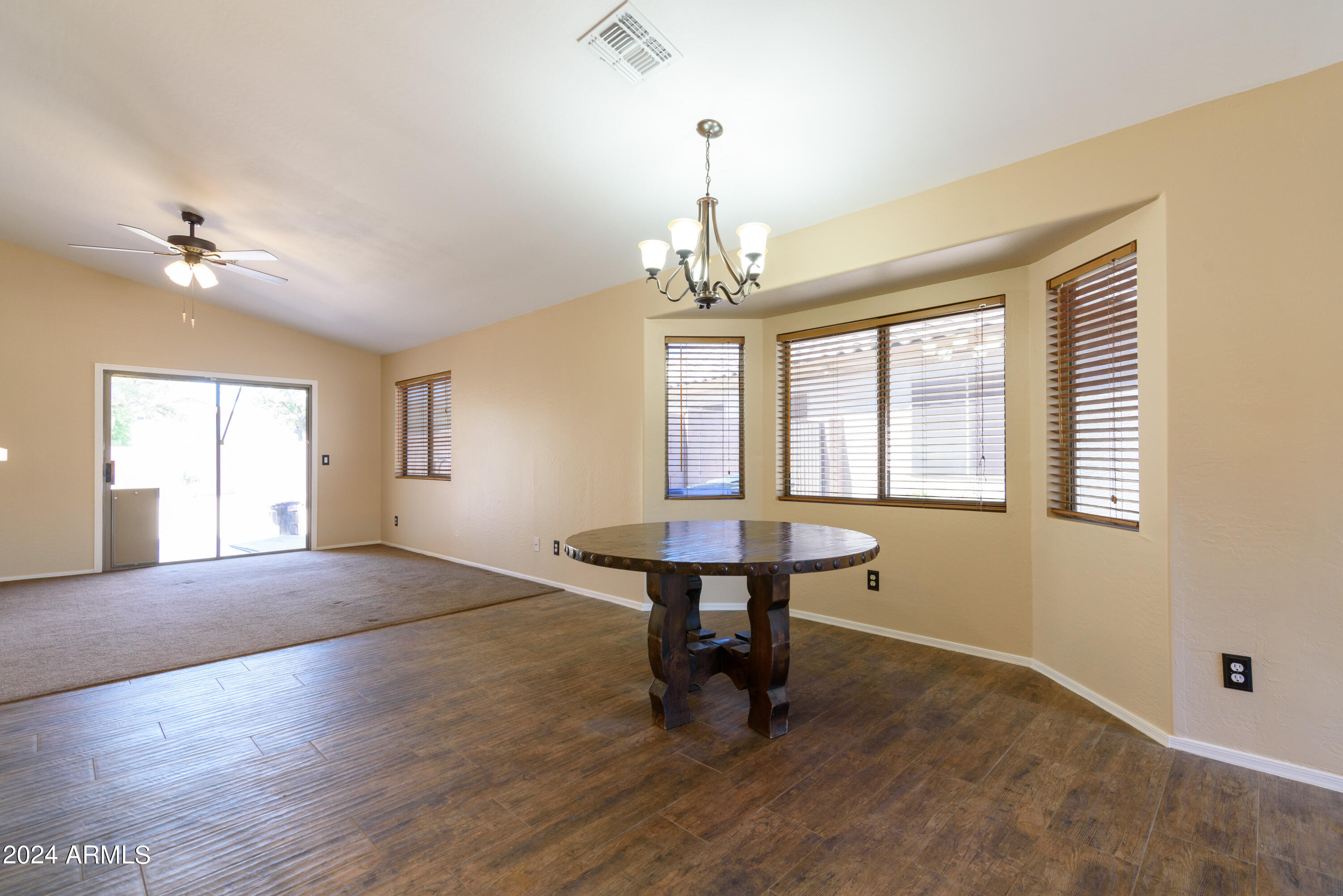 10649 West Monte Vista Road Avondale, AZ 85392 - Photo 6 of 28 a view of a livingroom with a window and a chandelier