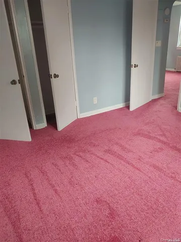 a view of empty room with front door