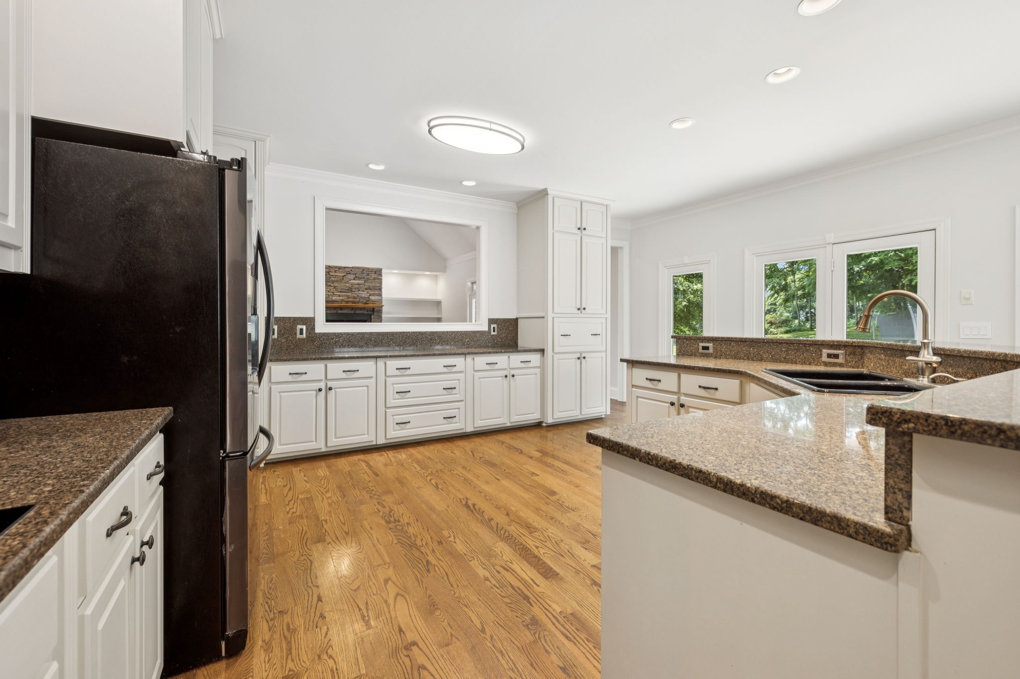 1416 Swindell Hollow Road Lebanon, TN 37090 - Photo 15 of 81 a large kitchen with granite countertop a sink a counter top space and cabinets