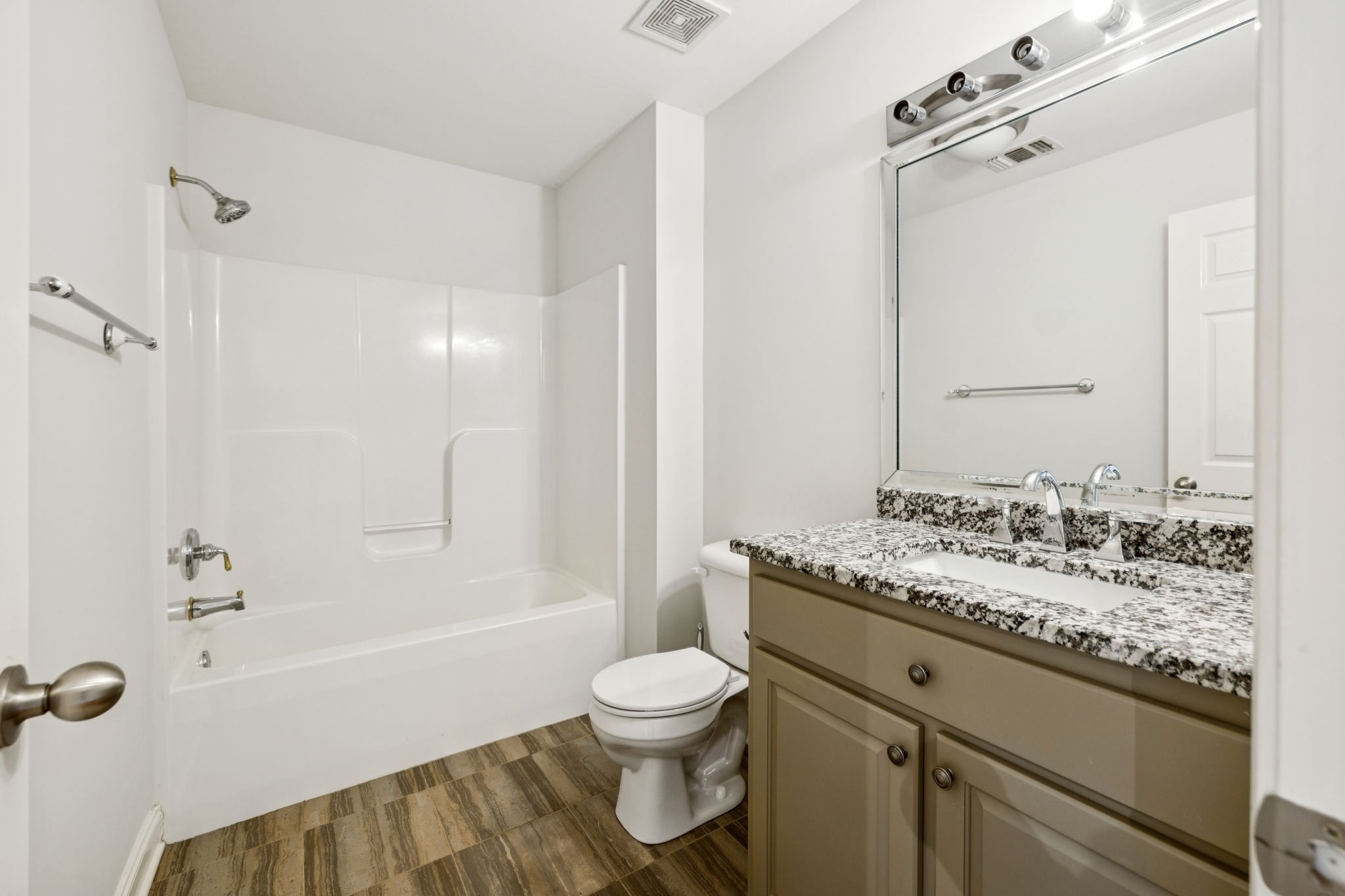 1416 Swindell Hollow Road Lebanon, TN 37090 - Photo 45 of 81 a bathroom with a granite countertop sink toilet a shower and a mirror