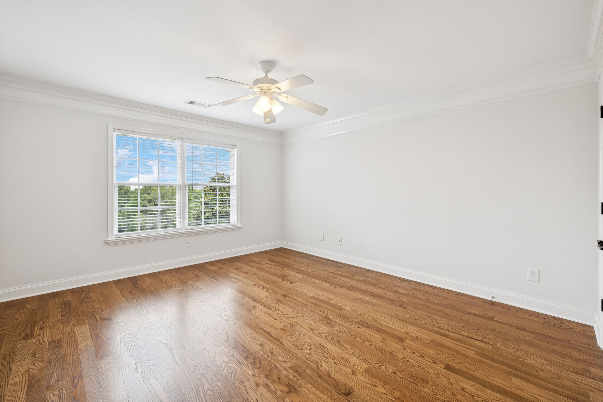 1416 Swindell Hollow Road Lebanon, TN 37090 - Photo 53 of 81 an empty room with wooden floor fan and windows