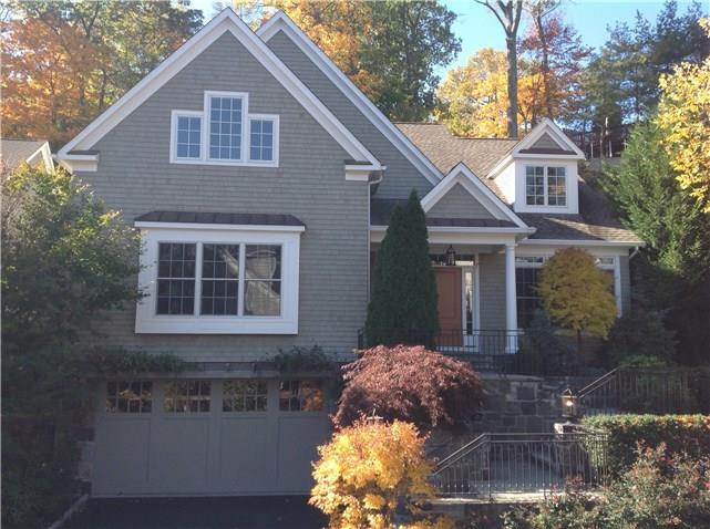 340 Valley Road, Unit 9 Greenwich, CT 06807 - Photo 1 of 1 a front view of a house with a yard