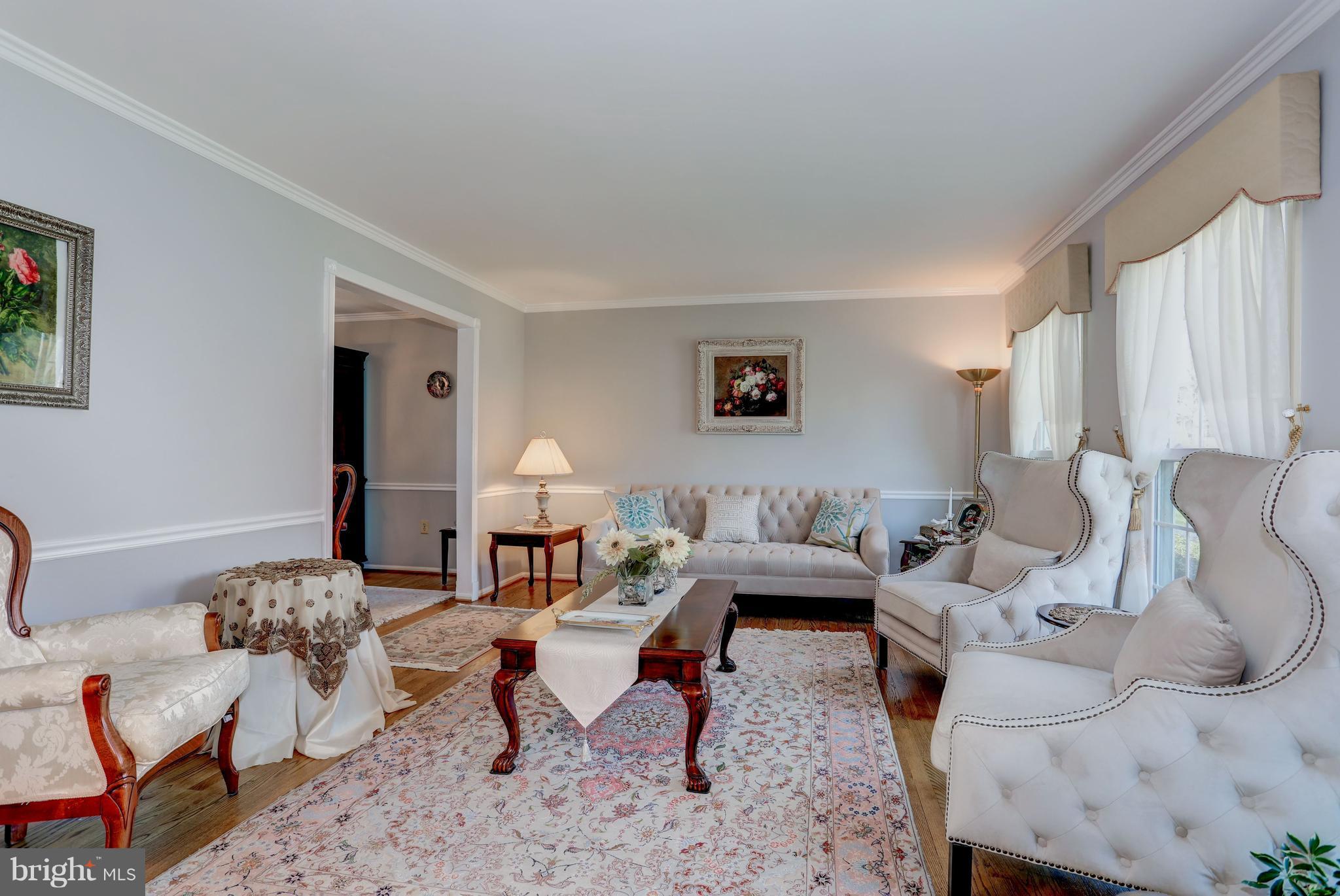 13345 Point Rider Lane Herndon, VA 20171 - Photo 11 of 30 a living room with furniture rug and a lamp