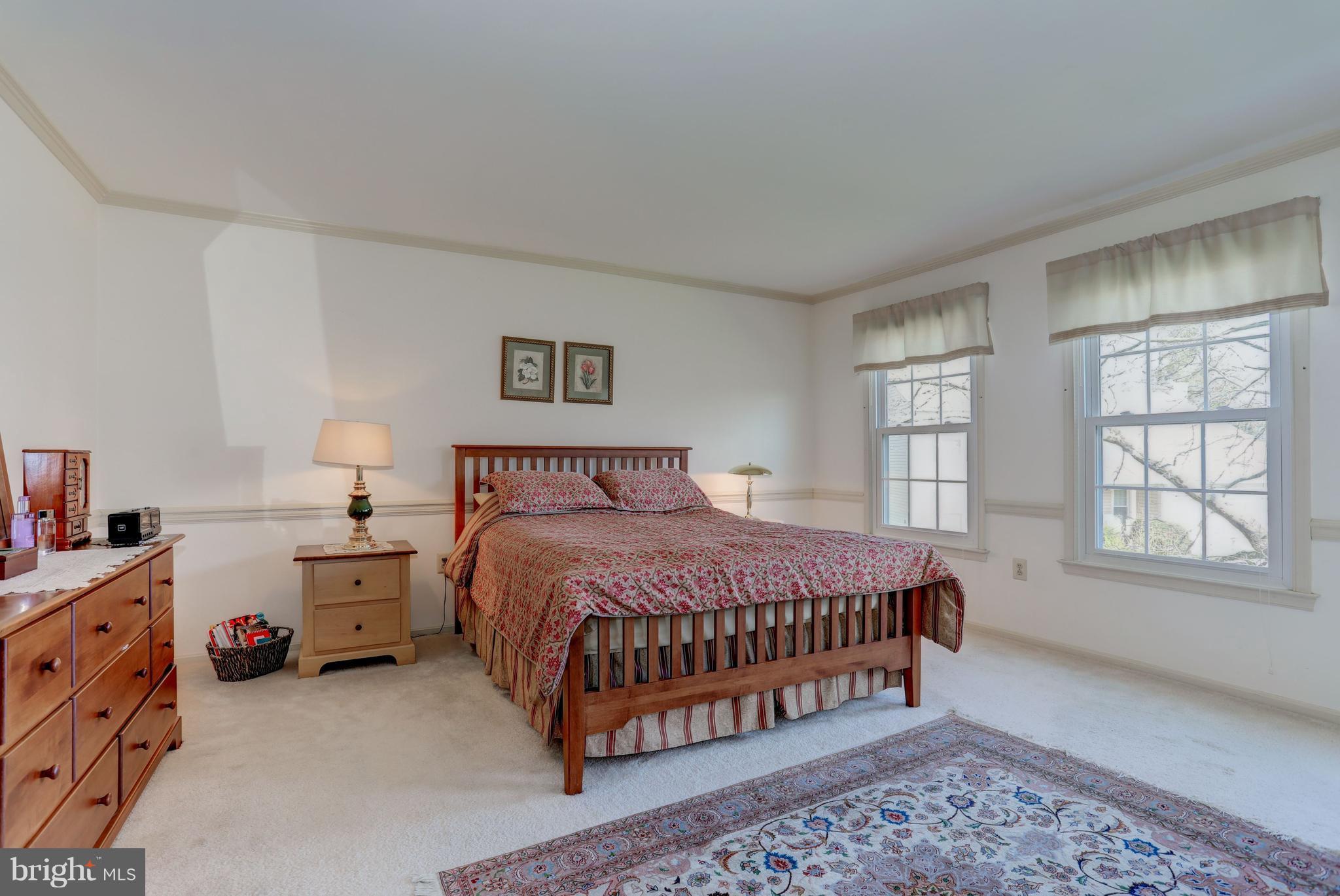 13345 Point Rider Lane Herndon, VA 20171 - Photo 18 of 30 a bedroom with a bed and window