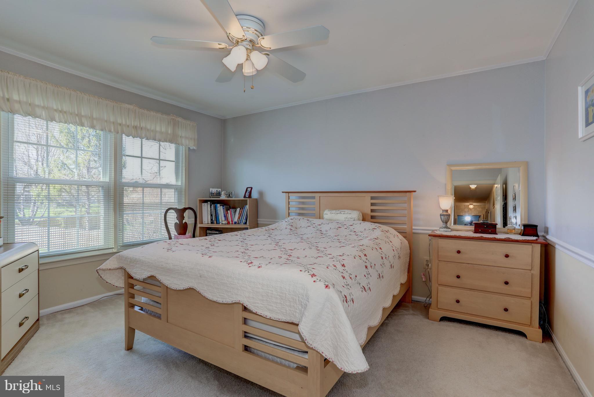 13345 Point Rider Lane Herndon, VA 20171 - Photo 20 of 30 a bedroom with a bed and a window dresser