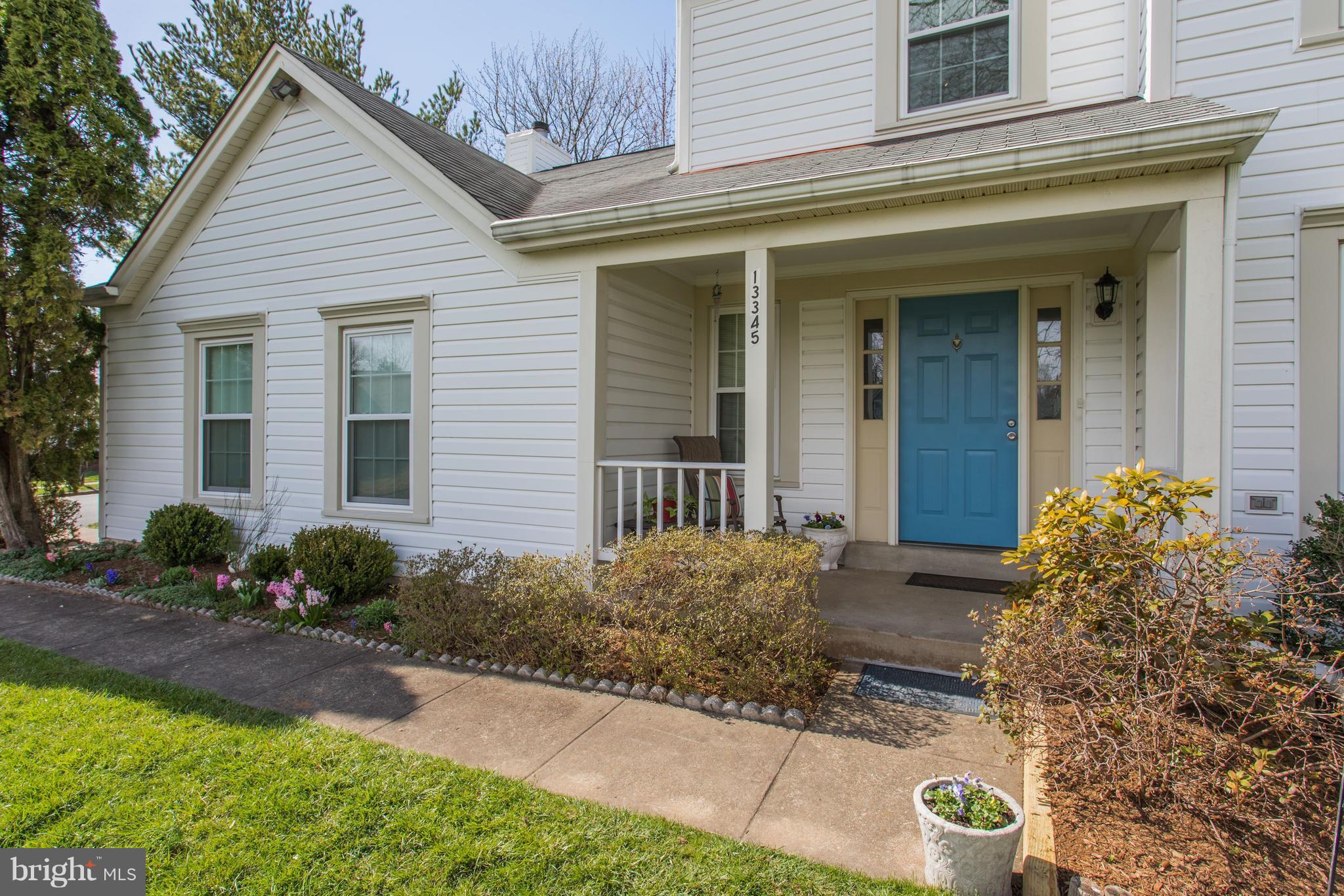 13345 Point Rider Lane Herndon, VA 20171 - Photo 3 of 30 a front view of a house with garden