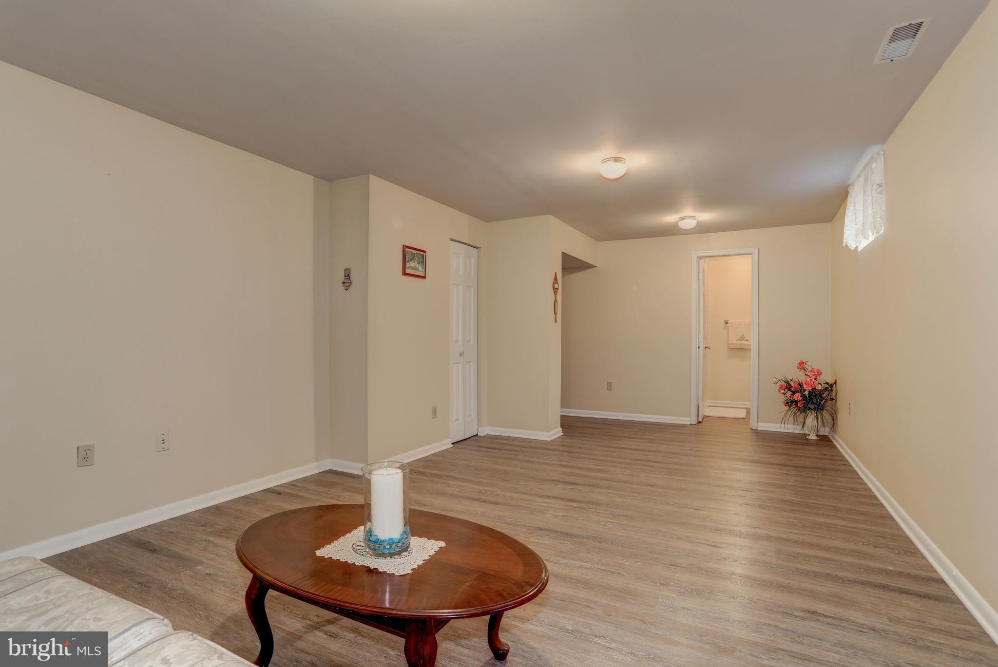 13345 Point Rider Lane Herndon, VA 20171 - Photo 24 of 30 a view of an empty room with wooden floor