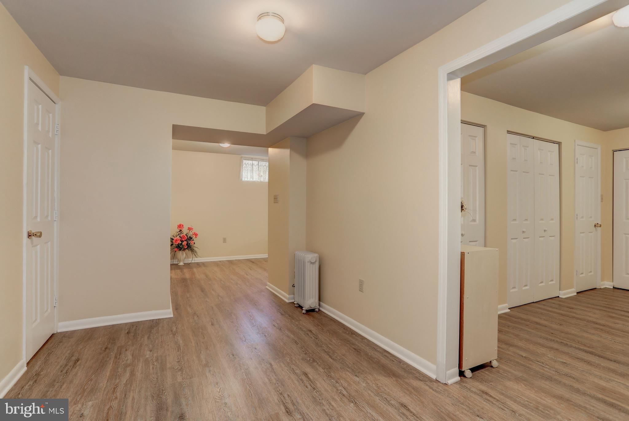 13345 Point Rider Lane Herndon, VA 20171 - Photo 26 of 30 an empty room with wooden floor and closet