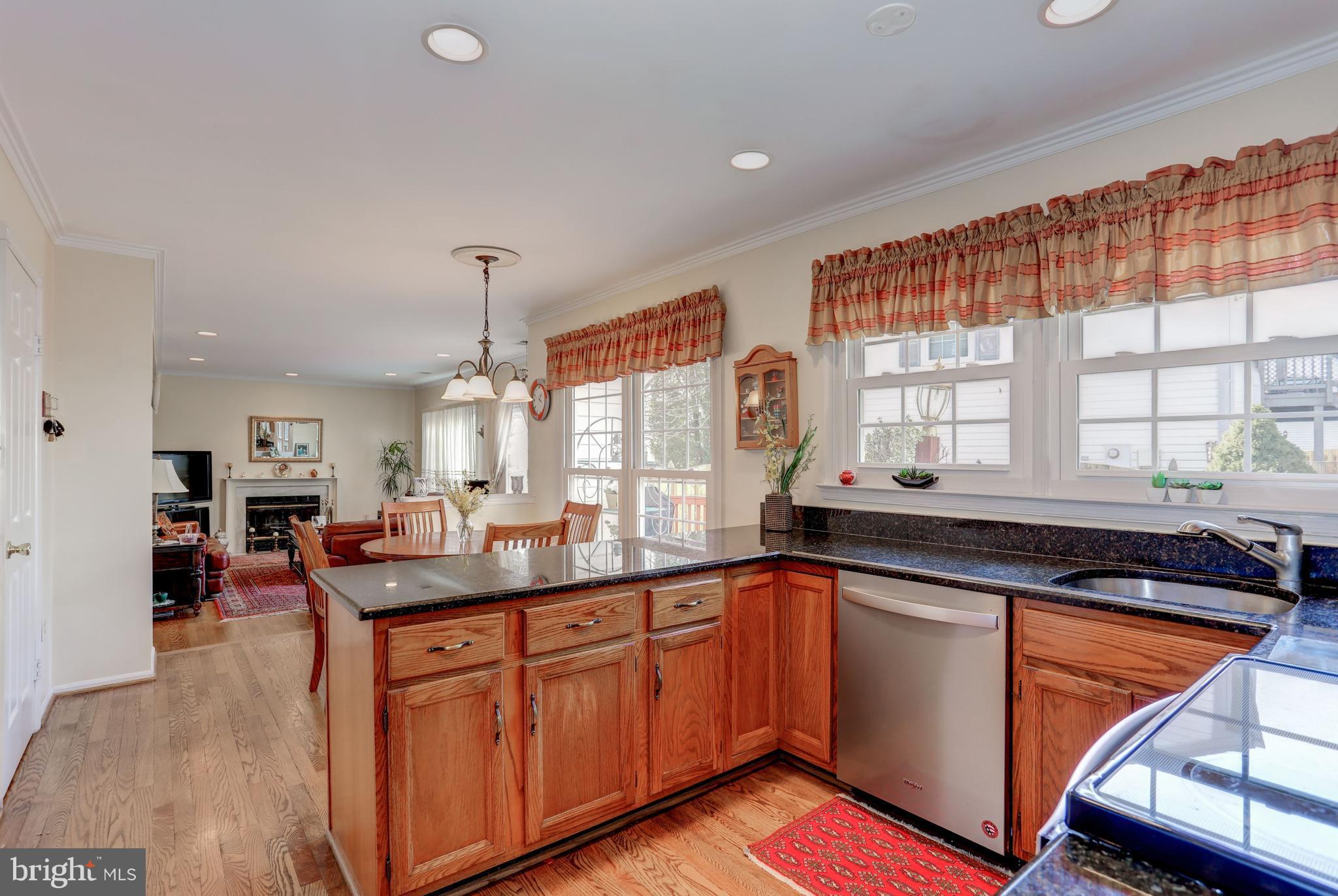 13345 Point Rider Lane Herndon, VA 20171 - Photo 6 of 30 a kitchen with stainless steel appliances granite countertop sink stove and cabinets