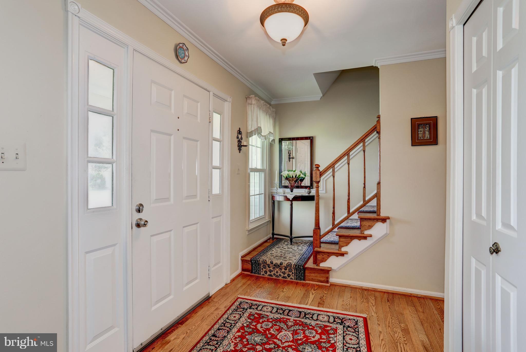 13345 Point Rider Lane Herndon, VA 20171 - Photo 8 of 30 a view of an entryway with wooden floor