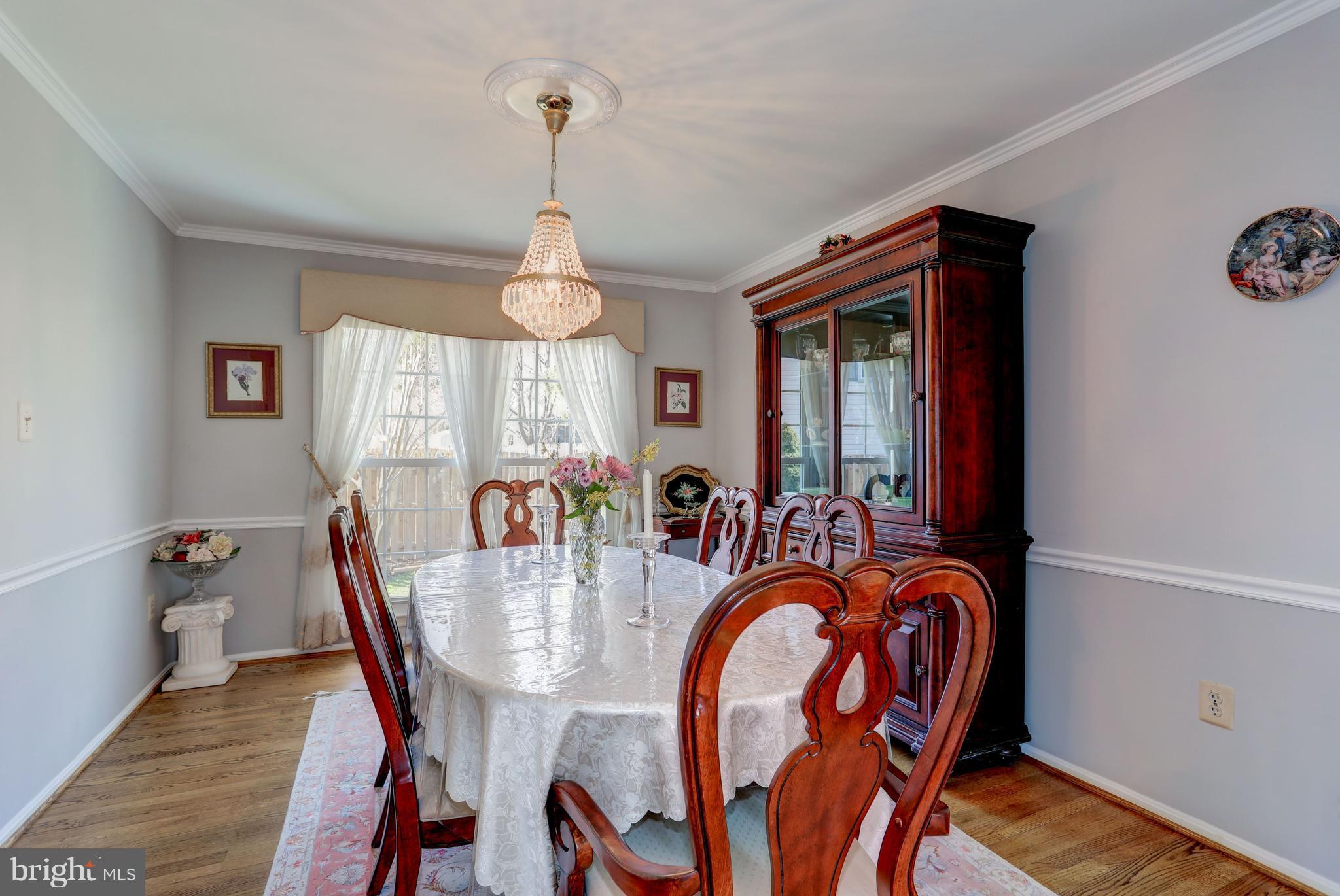 13345 Point Rider Lane Herndon, VA 20171 - Photo 9 of 30 a view of a dining room with furniture window and wooden floor