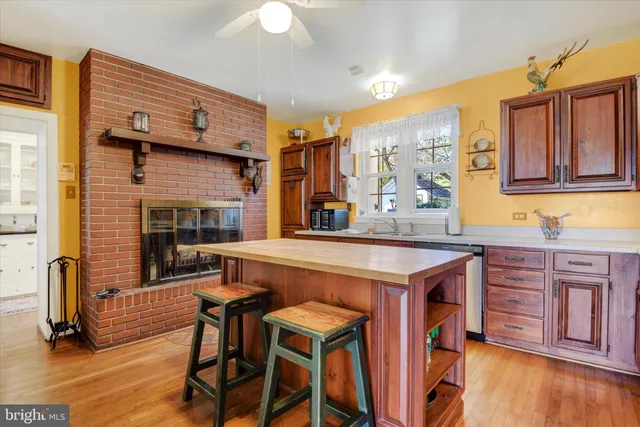 a open kitchen with stainless steel appliances granite countertop a stove and a refrigerator