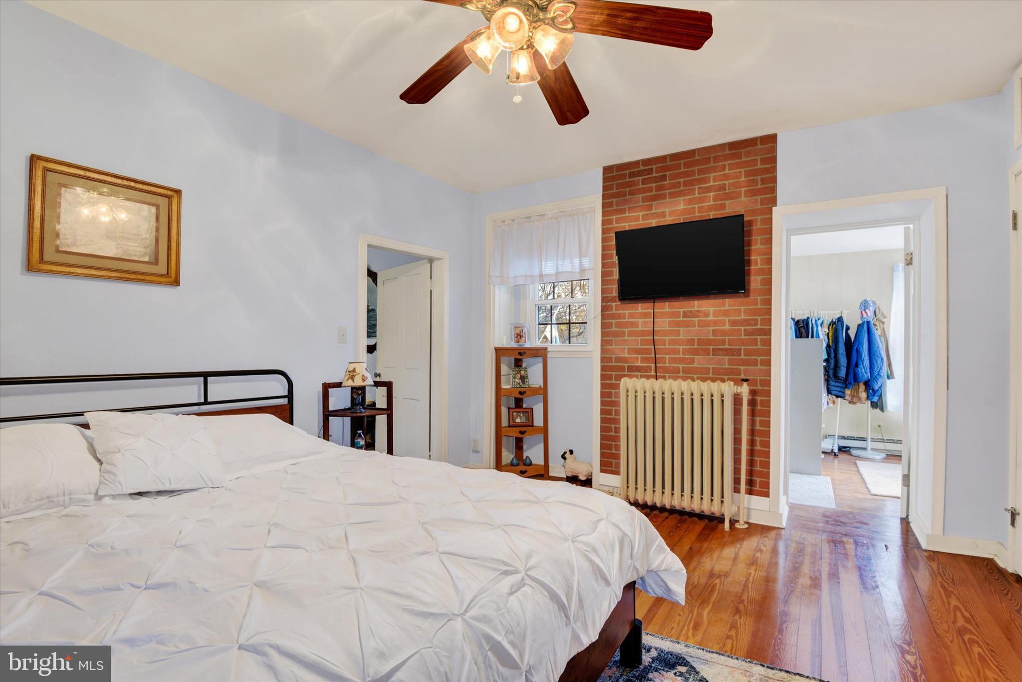 6739 South Clifton Road Frederick, MD 21703 - Photo 33 of 49 a bedroom with a bed and a flat screen tv