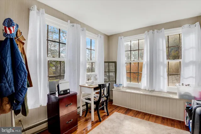 a view of a livingroom with furniture and windows