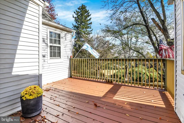 a view of a wooden deck with a bench
