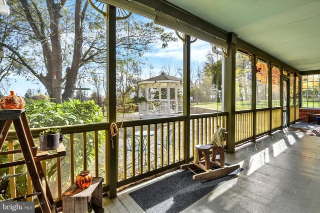 a view of a balcony with seating space