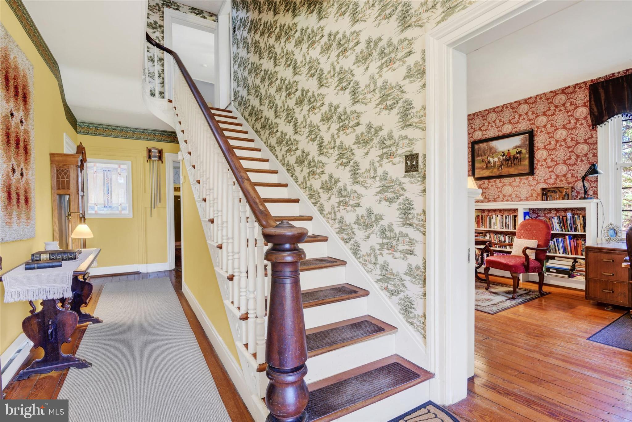 6739 South Clifton Road Frederick, MD 21703 - Photo 10 of 49 a view of an entryway with wooden floor and stairs