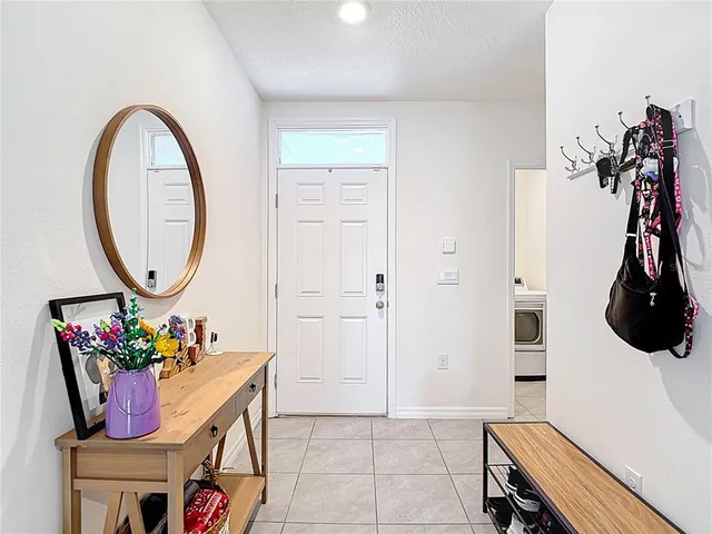 a room with furniture a mirror and a window