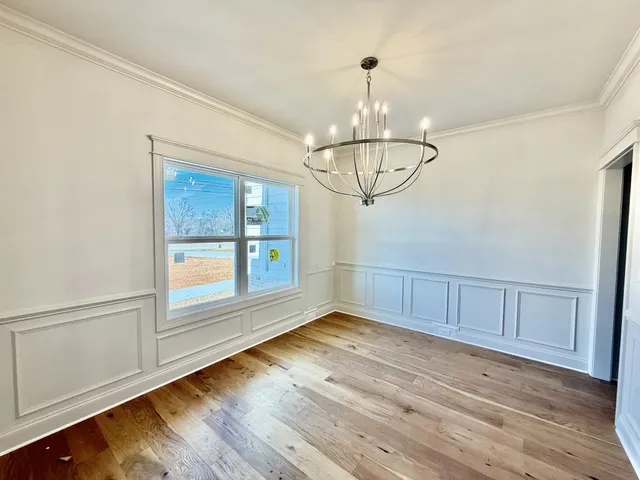 a large kitchen with kitchen island a sink counter space and stainless steel appliances