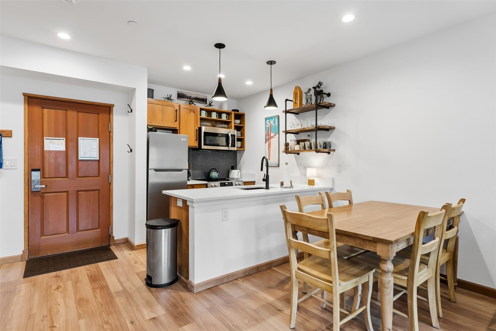 195 River Run Road, Unit 8015 Keystone, CO 80435 - Photo 9 of 35 a kitchen with a table and chairs in it