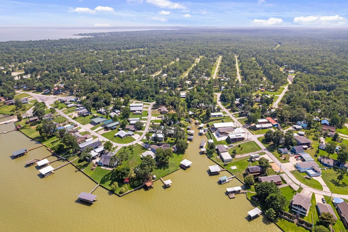 41 Key Largo Loop Point Blank, TX 77364 - Photo 24 of 40 an aerial view of residential houses with outdoor space and trees