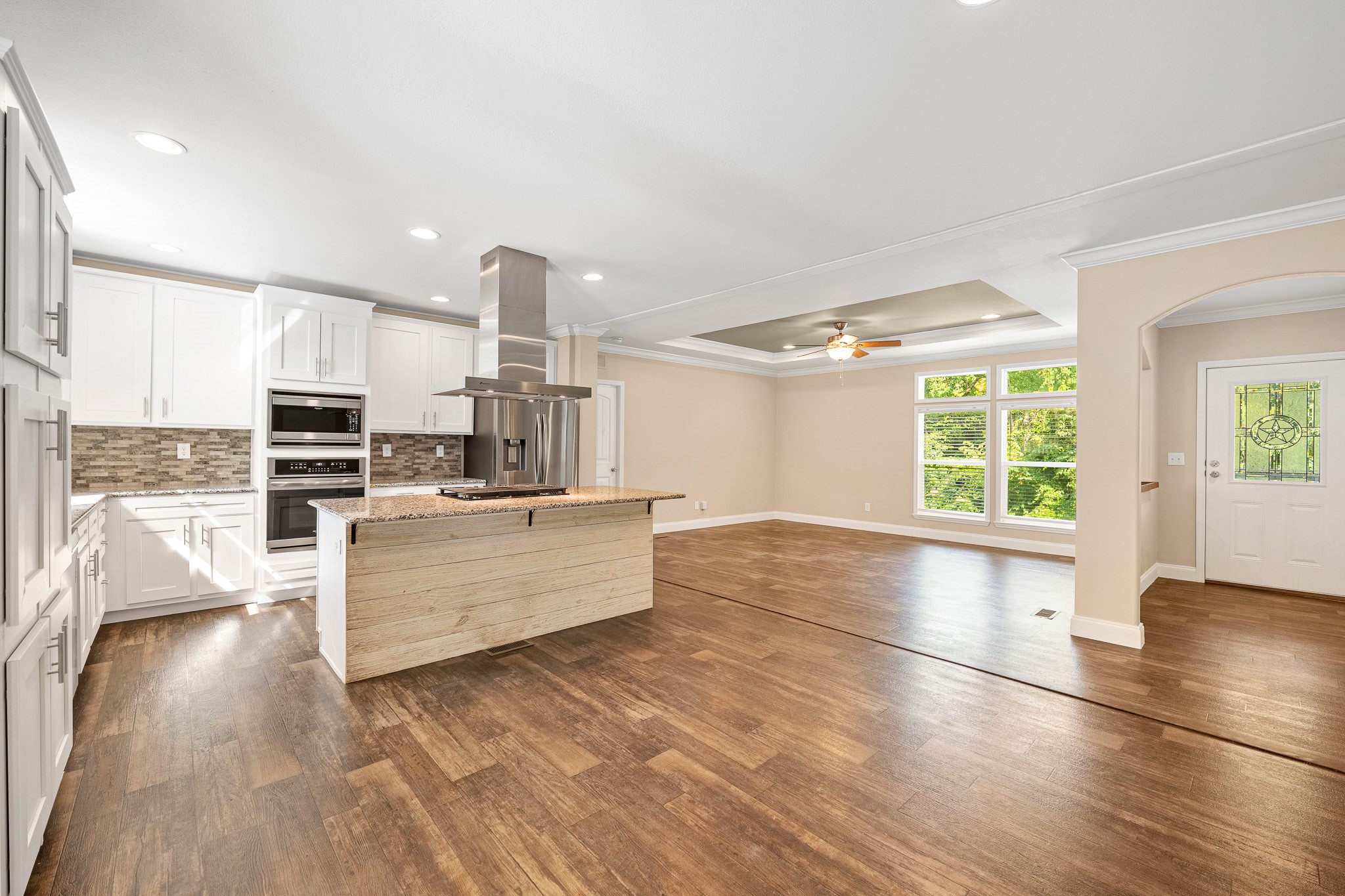 41 Key Largo Loop Point Blank, TX 77364 - Photo 3 of 40 a large kitchen with stainless steel appliances wooden floor and a large window