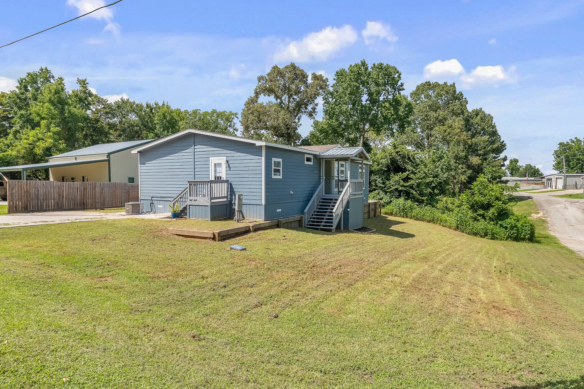 41 Key Largo Loop Point Blank, TX 77364 - Photo 32 of 40 a view of a house with a yard and potted plants