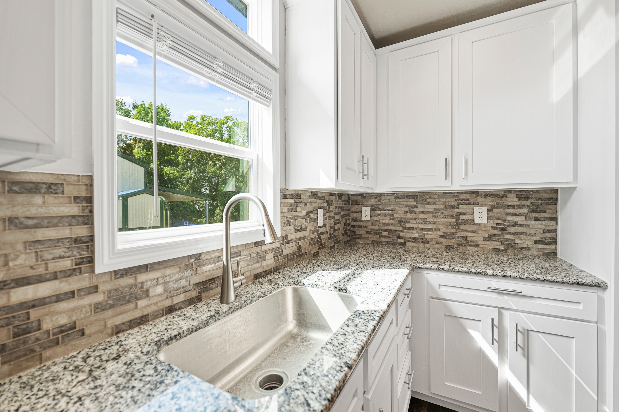 41 Key Largo Loop Point Blank, TX 77364 - Photo 10 of 40 a kitchen with granite countertop a sink and a stove