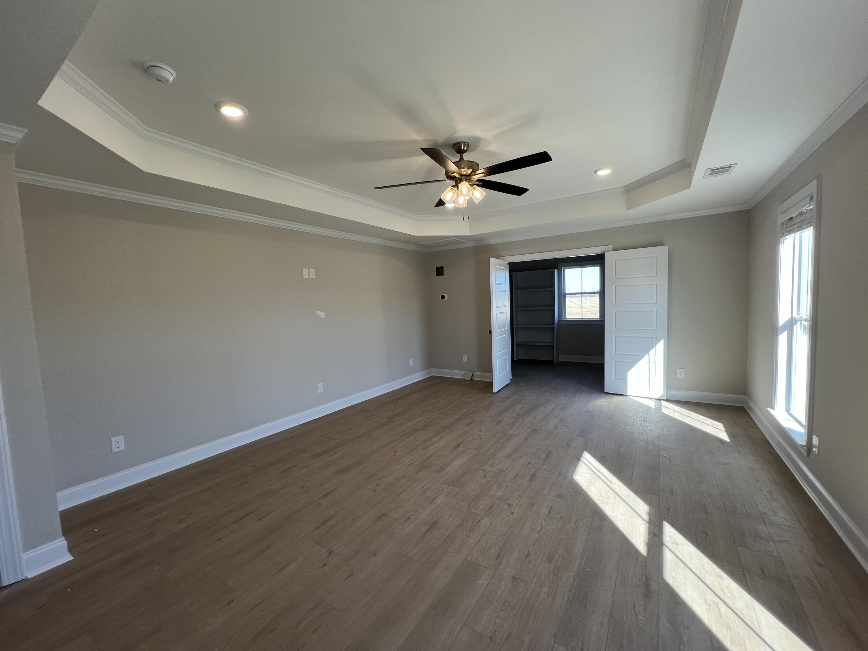 2747 Storm Branch Road Beech Island, SC 29842 - Photo 26 of 38 wooden floor in an empty room with a window