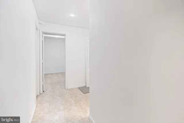 a bathroom with a sink mirror vanity and toilet
