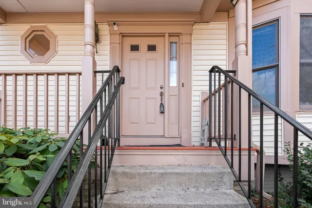 a view of entryway with wooden floor and stairs