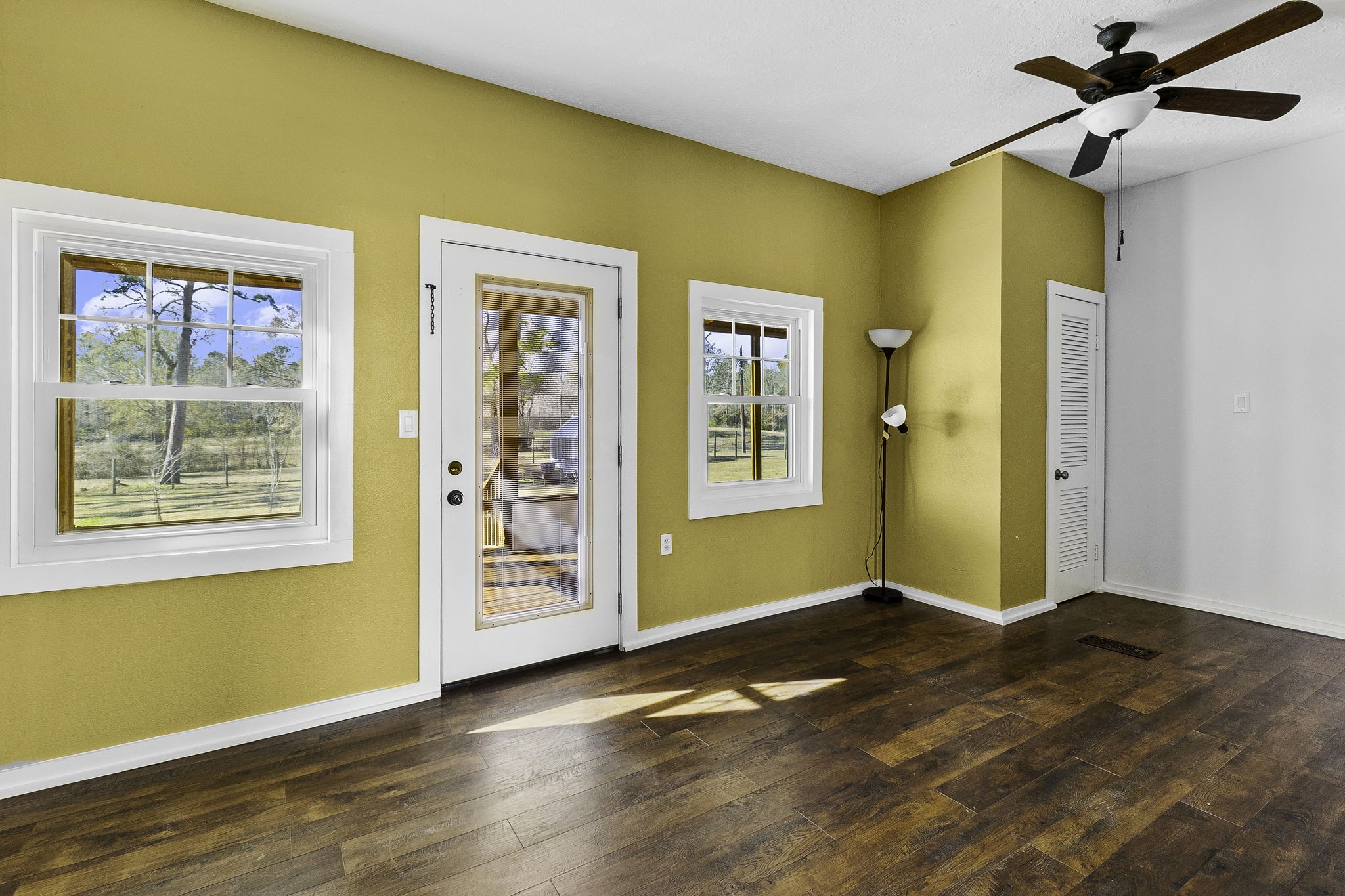 500 Highway 156 Point Blank, TX 77364 - Photo 9 of 47 Back left room opens to enclosed porch.