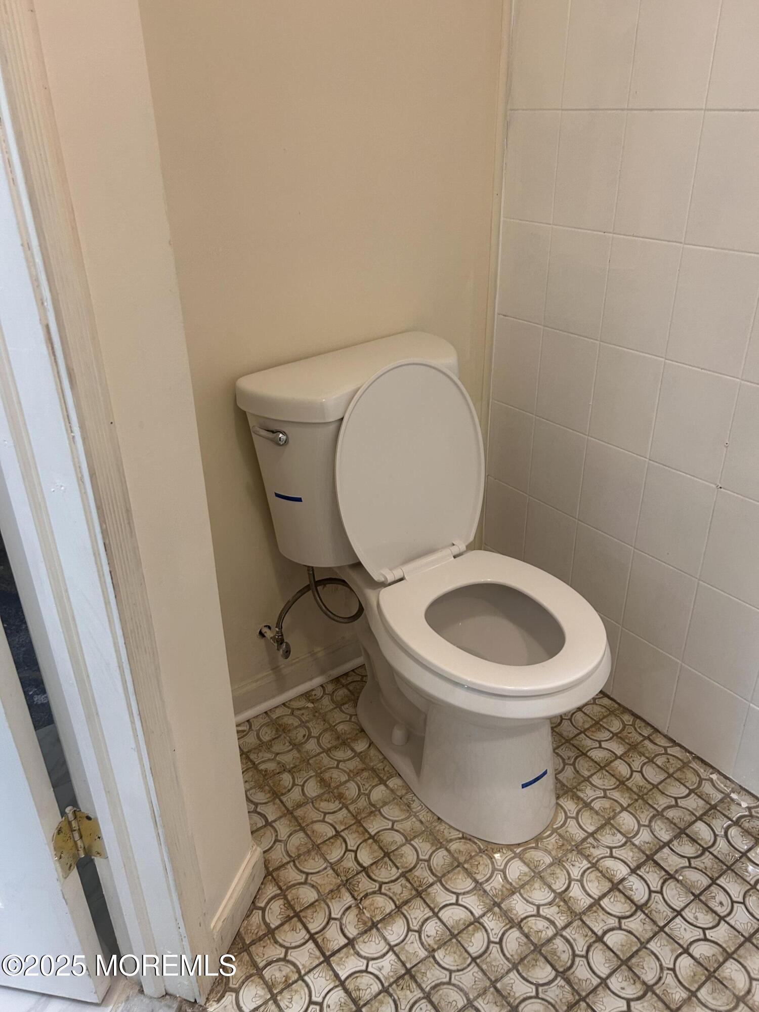 823 Bowman Road Jackson, NJ 08527 - Photo 11 of 27 a white toilet sitting next to a sink