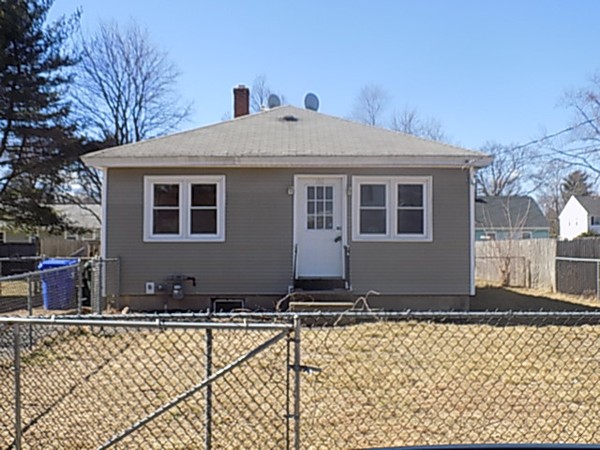 86 Wallace Street Springfield, MA 01119 - Photo 1 of 21 a front view of a house with a yard