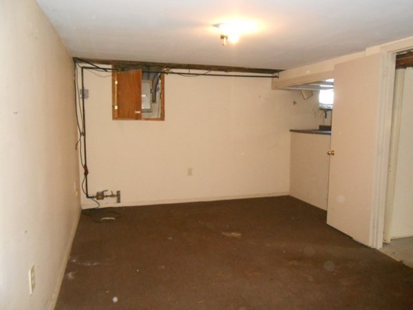 86 Wallace Street Springfield, MA 01119 - Photo 12 of 21 a view of a small space with wooden floor and a window