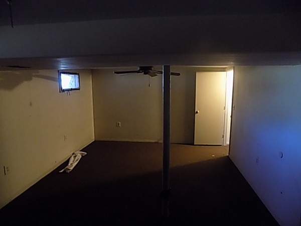 86 Wallace Street Springfield, MA 01119 - Photo 20 of 21 an empty room with wooden floor and windows