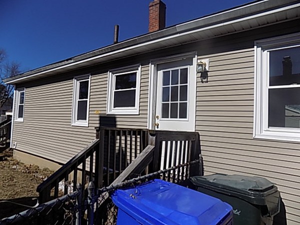 86 Wallace Street Springfield, MA 01119 - Photo 3 of 21 a view of a house with wooden deck