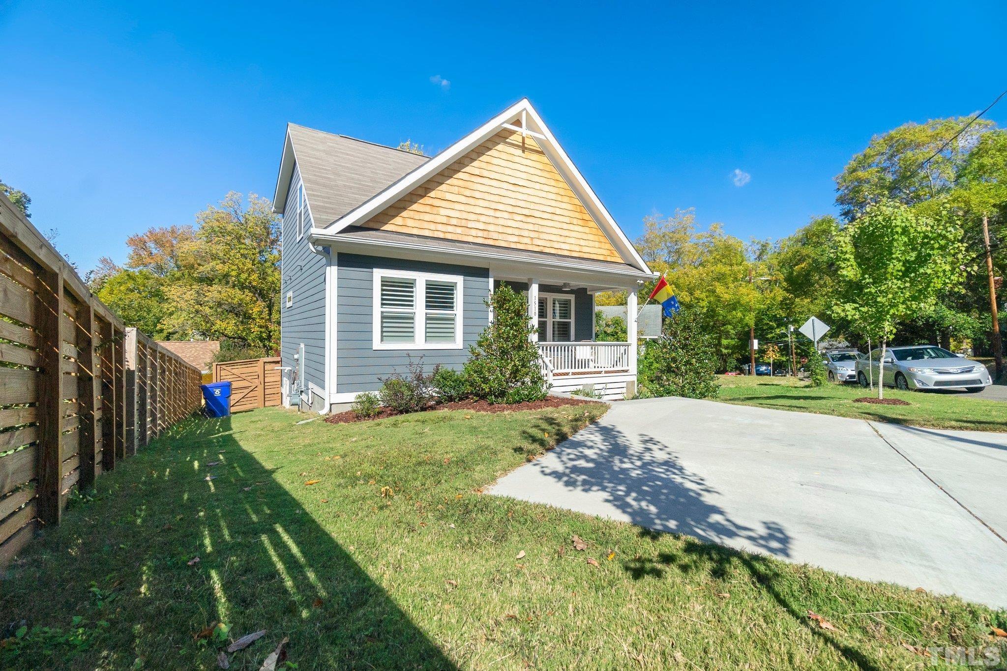 1510 Concord Street Durham, NC 27707 - Photo 1 of 17 a view of a house with backyard and trees