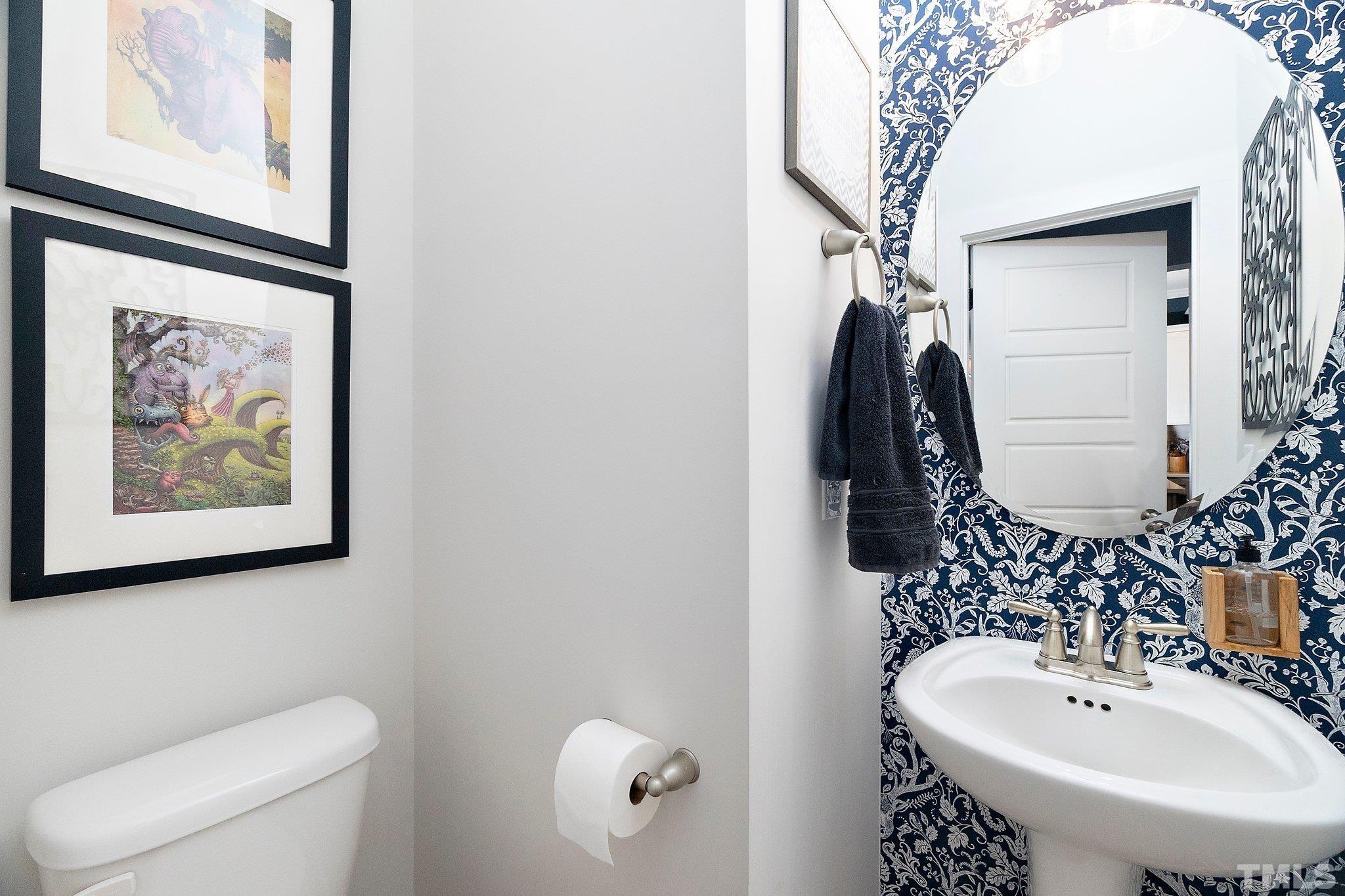 1510 Concord Street Durham, NC 27707 - Photo 11 of 17 a bathroom with a sink and mirror with toilet