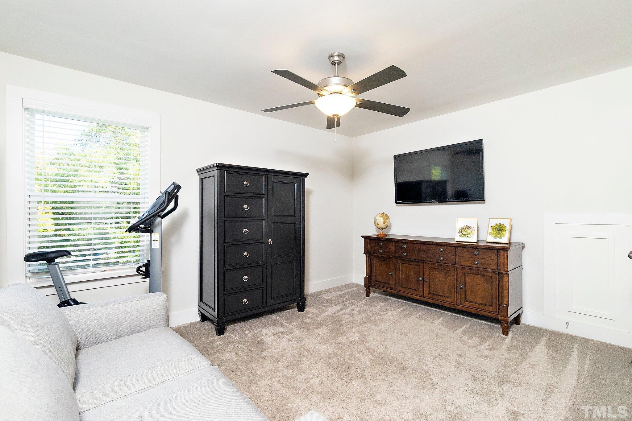 1510 Concord Street Durham, NC 27707 - Photo 12 of 17 a living room with furniture and a flat screen tv
