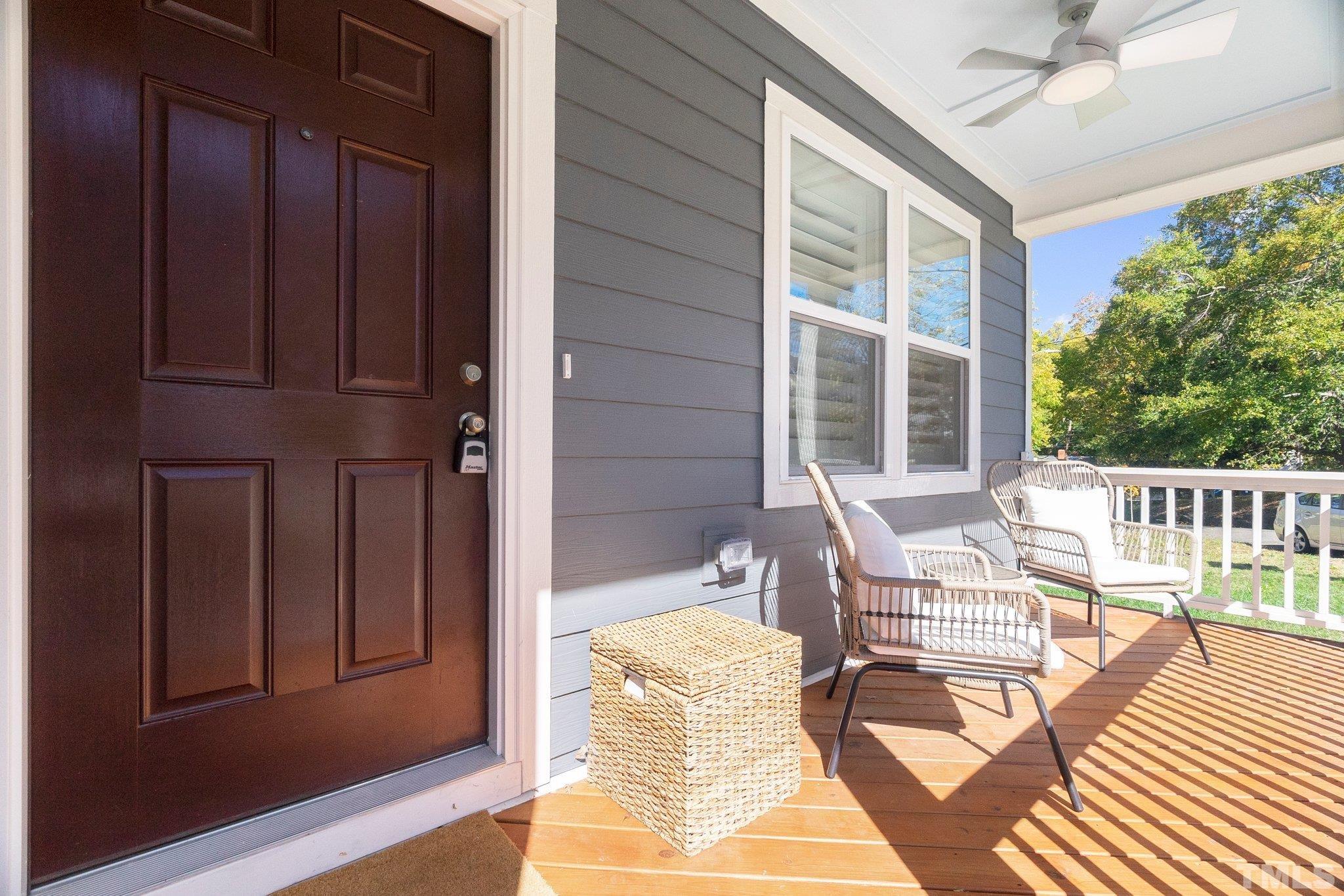 1510 Concord Street Durham, NC 27707 - Photo 2 of 17 a balcony with furniture and wooden floor
