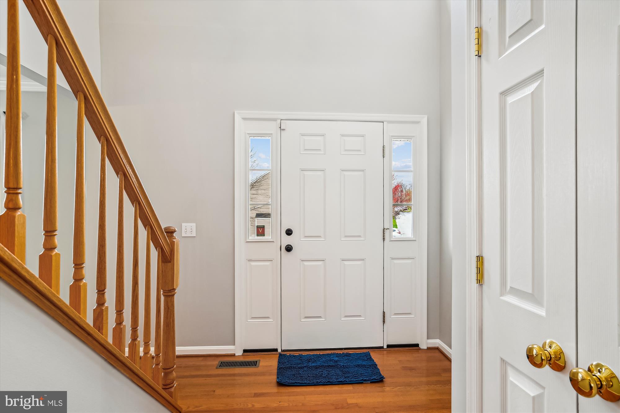 5958 Florey Road Hanover, MD 21076 - Photo 27 of 77 a view of entryway with wooden floor and stairs