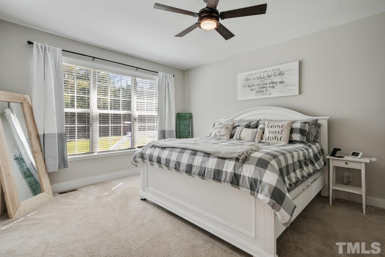 7255 Highway 231 Middlesex, NC 27557 - Photo 13 of 27 a bedroom with a large bed and a window