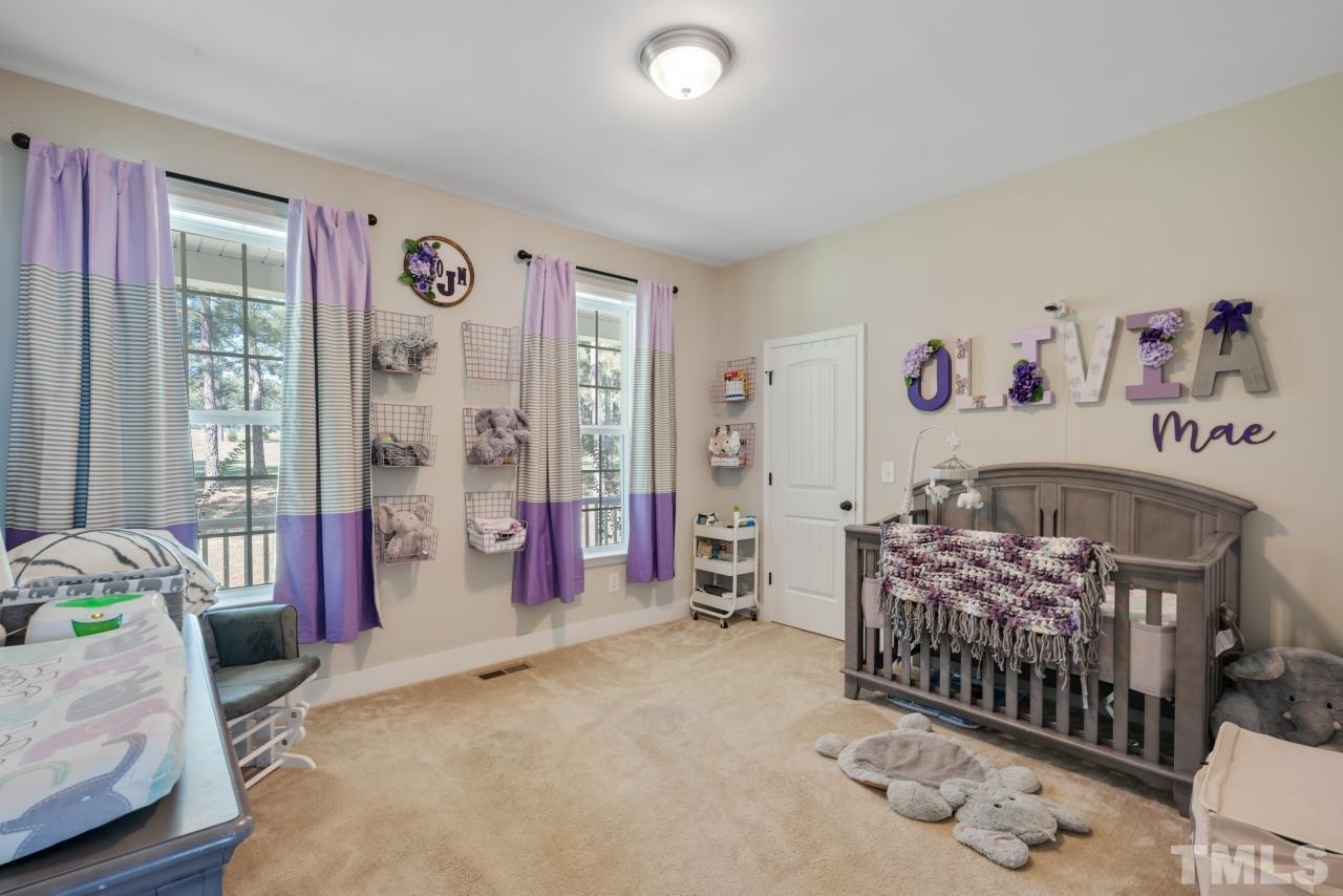 7255 Highway 231 Middlesex, NC 27557 - Photo 15 of 27 a bedroom with a bed and a white walls