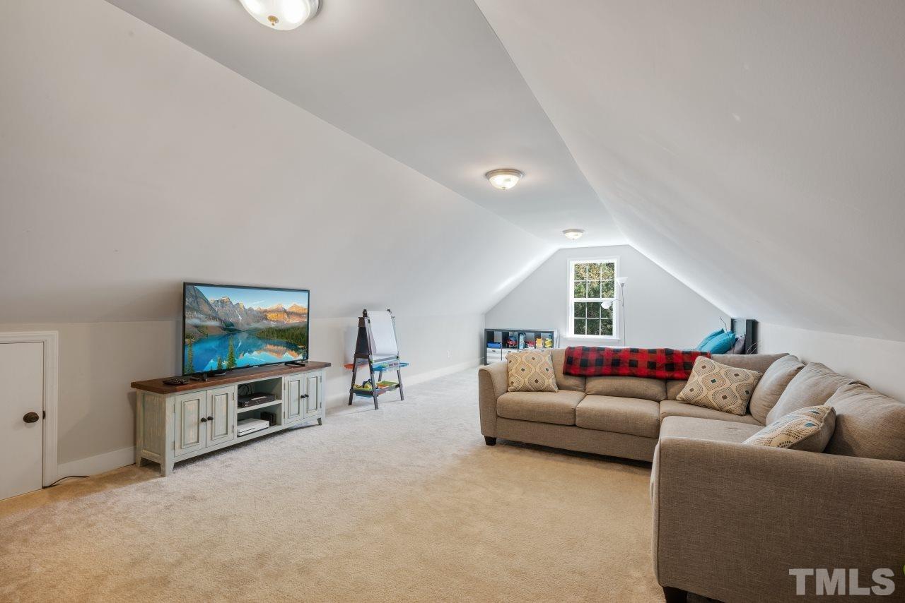 7255 Highway 231 Middlesex, NC 27557 - Photo 20 of 27 a living room with furniture and a flat screen tv
