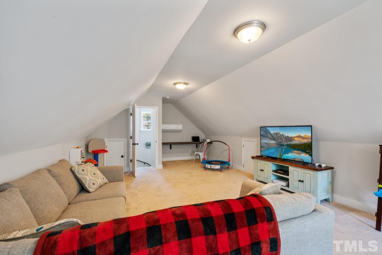 7255 Highway 231 Middlesex, NC 27557 - Photo 21 of 27 a living room with furniture and a flat screen tv