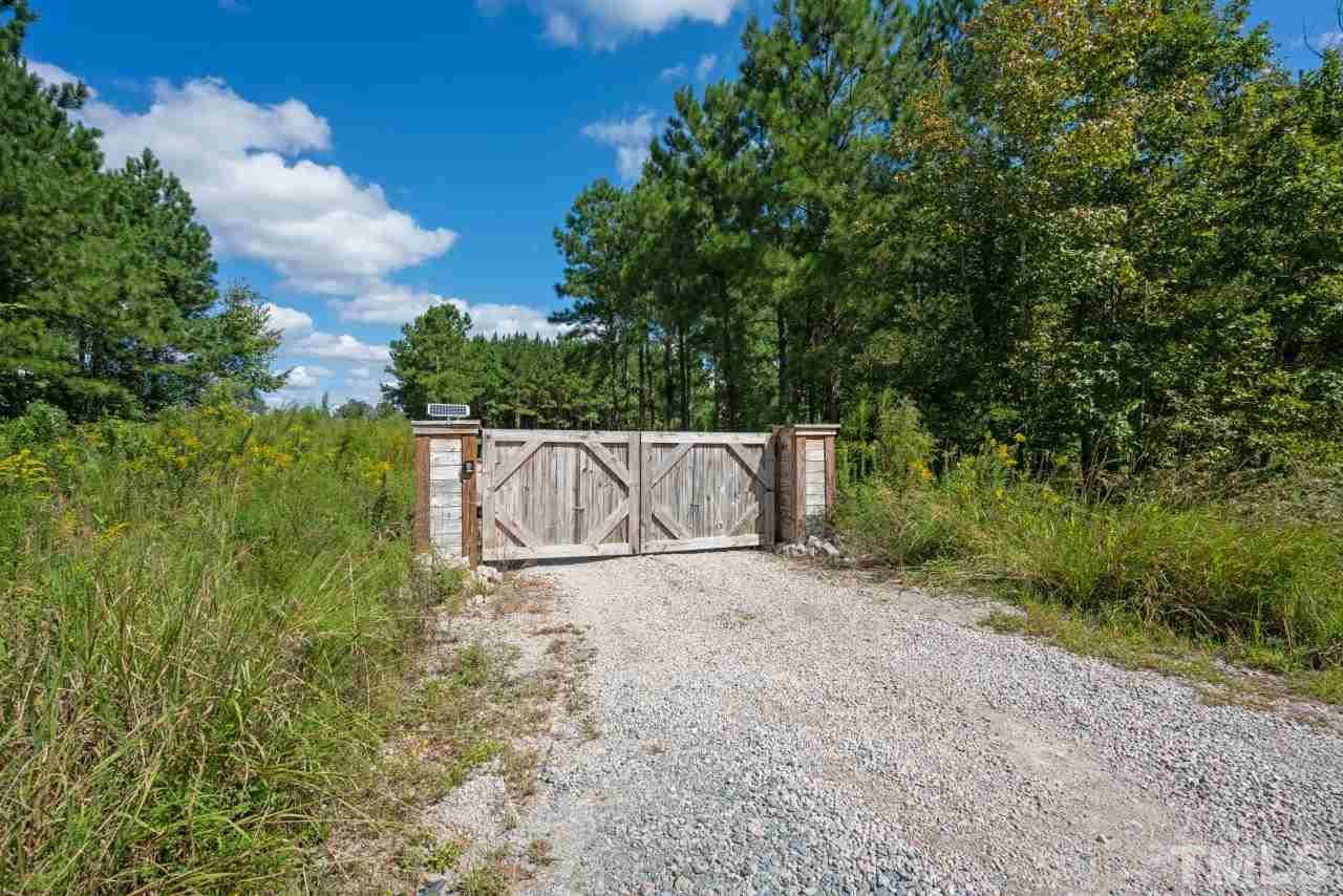 7255 Highway 231 Middlesex, NC 27557 - Photo 27 of 27 a white house with tree in the background